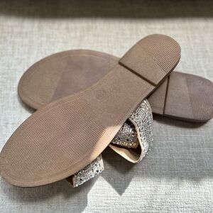 Gently worn nude rhinestone slip on sandals. Size 10